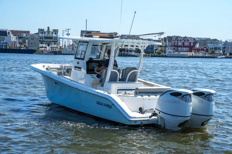  Yacht Photos Pics 2022 Sea Pro 320 DLX Offshore boat on water, featuring dual Suzuki engines.