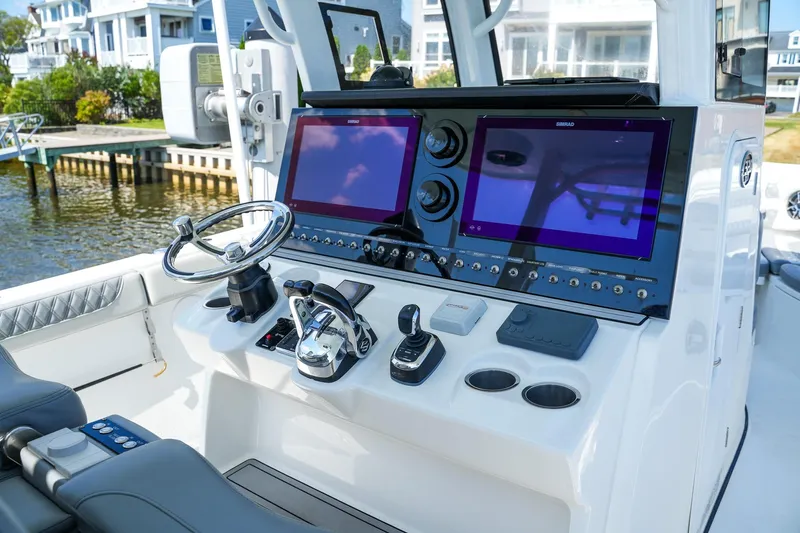  Yacht Photos Pics 2022 Sea Pro 320 DLX Offshore helm with dual screens and modern controls.