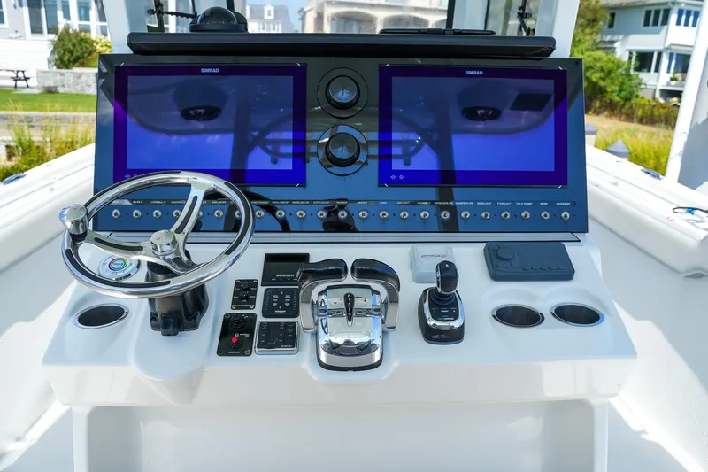  Yacht Photos Pics 2022 Sea Pro 320 DLX Offshore helm with dual Simrad displays and advanced controls.
