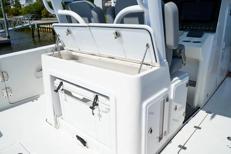  Yacht Photos Pics 2022 Sea Pro 320 DLX Offshore boat interior with storage compartments and seating.