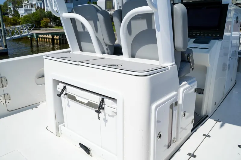  Yacht Photos Pics 2022 Sea Pro 320 DLX Offshore boat interior with seating and storage compartments.