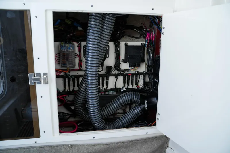  Yacht Photos Pics 2022 Sea Pro 320 DLX Offshore electrical compartment with wiring and ventilation system.