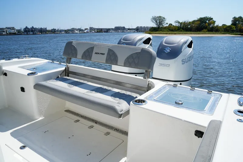  Yacht Photos Pics 2022 Sea Pro 320 DLX Offshore boat with dual Suzuki 350 engines on a sunny day.