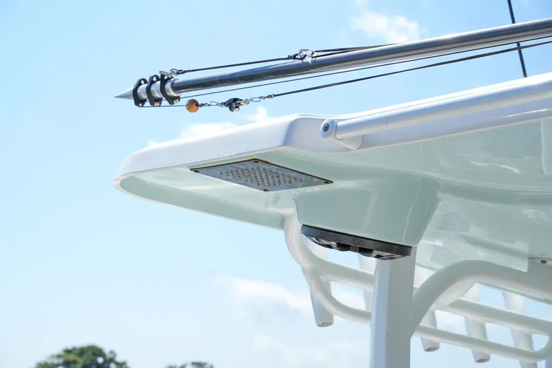  Yacht Photos Pics 2022 Sea Pro 320 DLX Offshore boat detail with fishing rod holder and canopy.