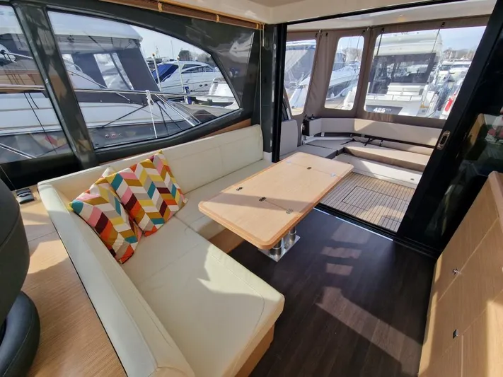 324000084-r40 Yacht Photos Pics Luxurious interior of 2025 Bavaria R40 yacht with modern seating and vibrant cushions.