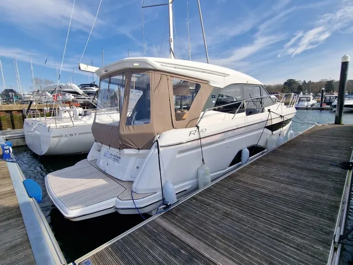 324000084-r40 Yacht Photos Pics Bavaria R40 yacht, 2025 model, docked at marina under clear blue sky.