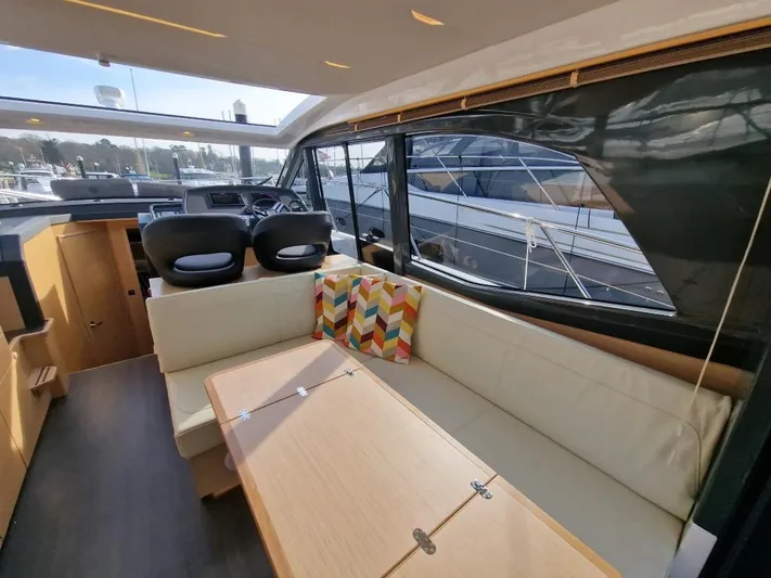 324000084-r40 Yacht Photos Pics Luxurious interior of 2025 Bavaria R40 yacht with modern seating and vibrant cushion.