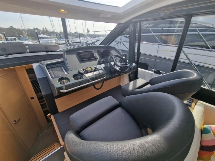 324000084-r40 Yacht Photos Pics Helm of 2025 Bavaria R40 yacht with modern controls and seating.