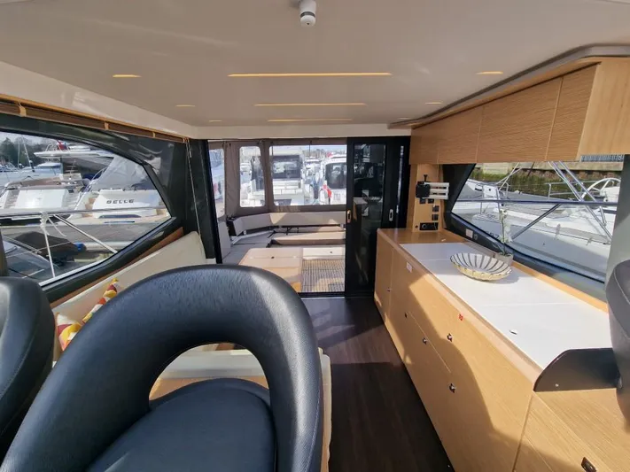 324000084-r40 Yacht Photos Pics Luxurious interior of 2025 Bavaria R40 yacht with modern furnishings and panoramic windows.