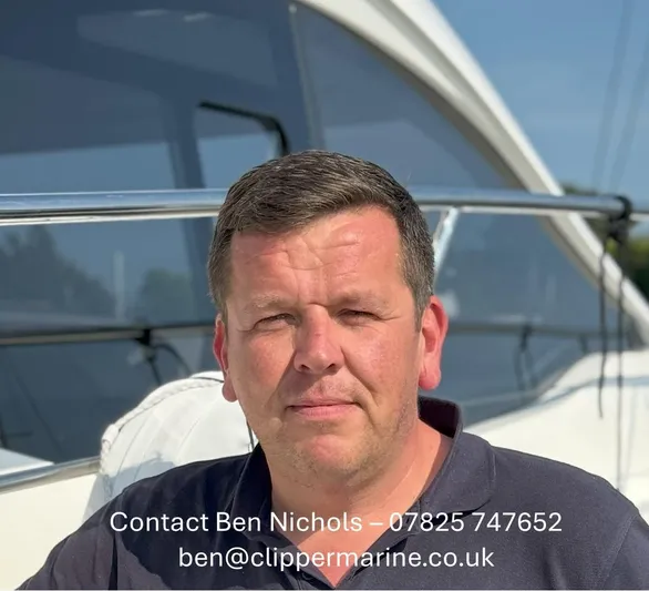324000084-r40 Yacht Photos Pics Man on Bavaria R40 yacht, 2025 model, with contact details displayed.