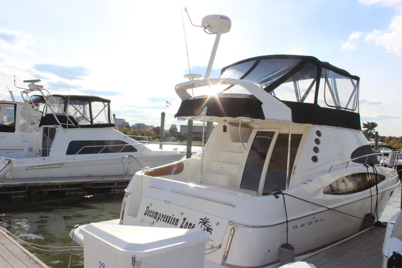  Yacht Photos Pics 2002 Regal Commodore 3880 yacht docked at marina under clear sky.