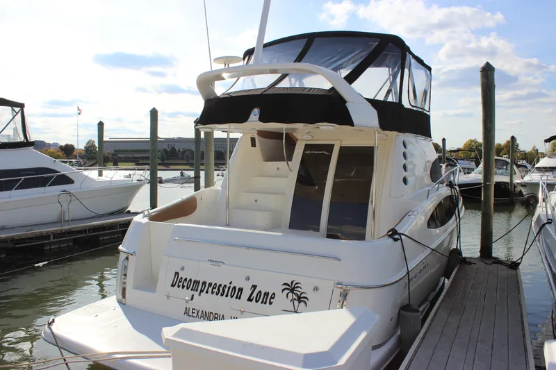  Yacht Photos Pics 2002 Regal Commodore 3880 yacht docked, named "Decompression Zone," in Alexandria marina.