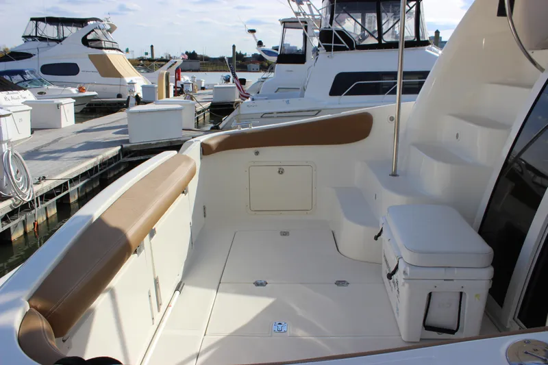  Yacht Photos Pics 2002 Regal Commodore 3880 yacht docked, featuring spacious deck and seating area.