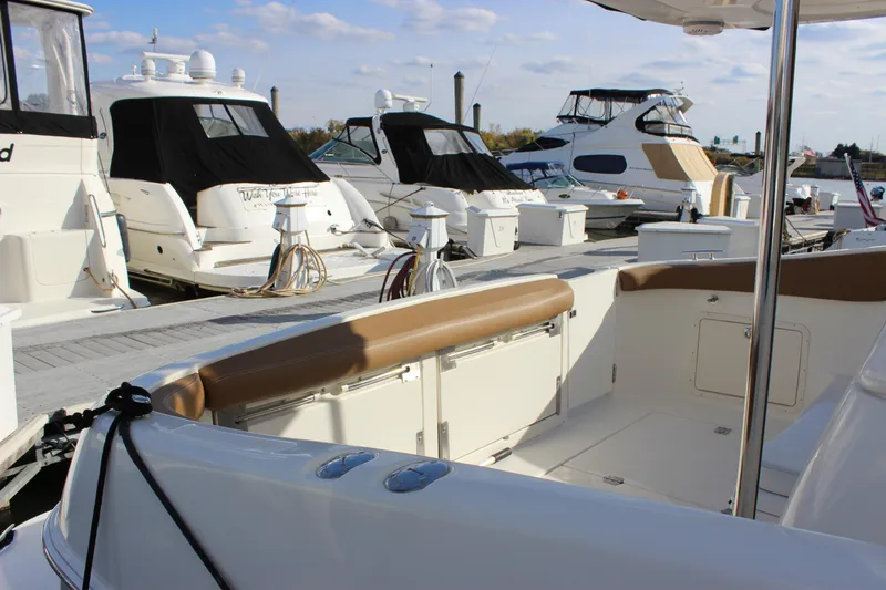  Yacht Photos Pics 2002 Regal Commodore 3880 yacht docked among other boats at a marina.