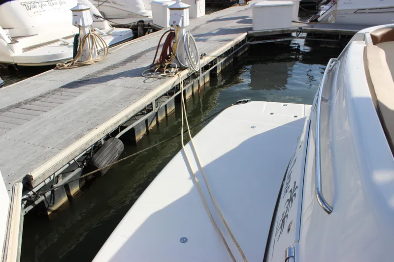  Yacht Photos Pics 2002 Regal Commodore 3880 yacht docked at marina with mooring lines.