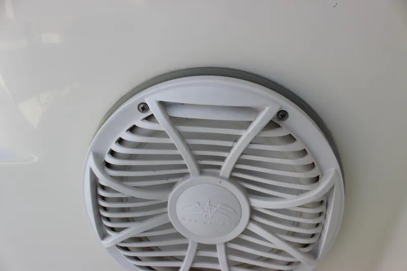  Yacht Photos Pics Close-up of a white speaker grille on a 2002 Regal Commodore 3880 boat.