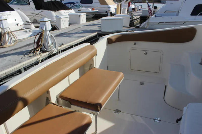  Yacht Photos Pics 2002 Regal Commodore 3880 boat interior with tan seating at marina.
