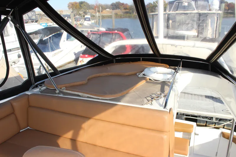  Yacht Photos Pics Interior view of 2002 Regal Commodore 3880 yacht with tan seating and life preserver.