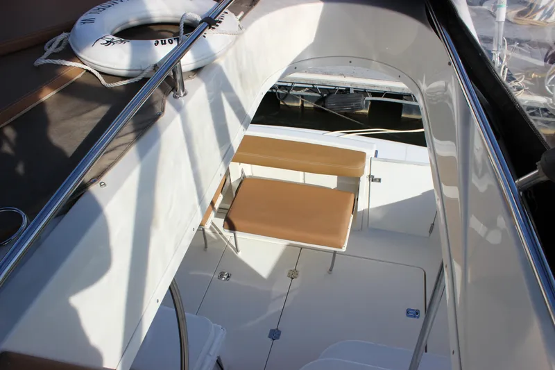  Yacht Photos Pics 2002 Regal Commodore 3880 boat interior with seating and life preserver.