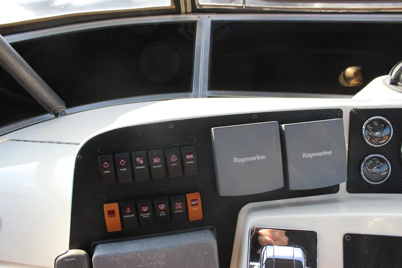  Yacht Photos Pics Control panel of 2002 Regal Commodore 3880 boat with Raymarine equipment and gauges.