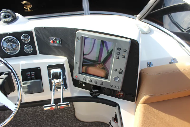  Yacht Photos Pics Control panel of 2002 Regal Commodore 3880 boat with navigation equipment and gauges.