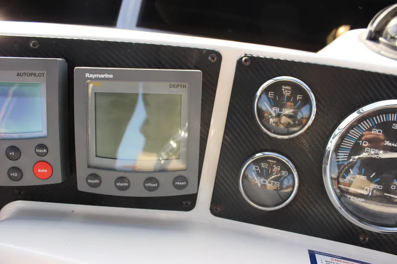  Yacht Photos Pics Dashboard of a 2002 Regal Commodore 3880 with autopilot and depth gauges.