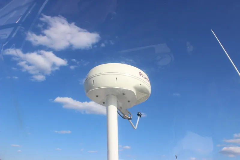  Yacht Photos Pics Radar equipment on a 2002 Regal Commodore 3880 against a clear blue sky.
