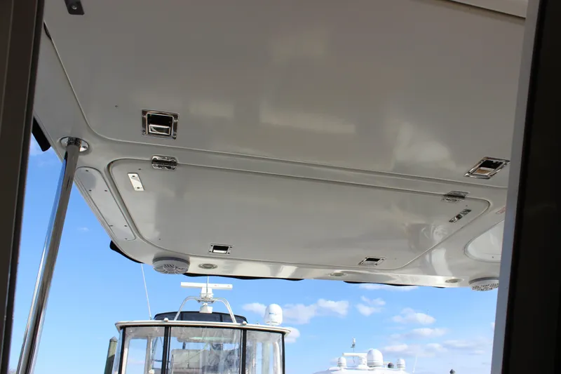  Yacht Photos Pics 2002 Regal Commodore 3880 yacht ceiling view with clear blue sky background.