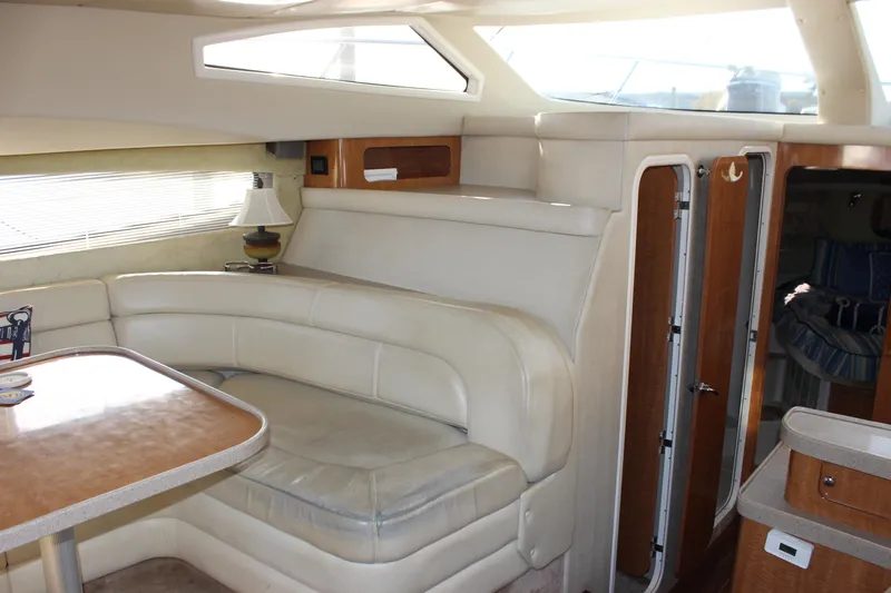  Yacht Photos Pics Interior of 2002 Regal Commodore 3880 yacht with leather seating and wooden accents.