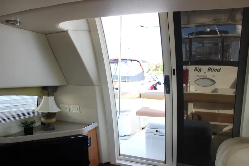  Yacht Photos Pics Interior view of 2002 Regal Commodore 3880 yacht with sliding glass door.