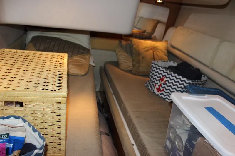  Yacht Photos Pics Interior cabin of 2002 Regal Commodore 3880 with storage baskets and cushions.
