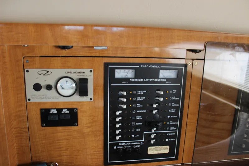  Yacht Photos Pics Control panel of a 2002 Regal Commodore 3880 boat with battery and level monitors.