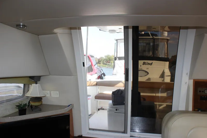  Yacht Photos Pics Interior view of 2002 Regal Commodore 3880 yacht with sliding glass door.