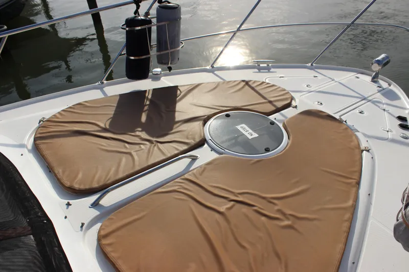  Yacht Photos Pics 2002 Regal Commodore 3880 boat deck with tan cushions and railing.