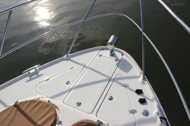  Yacht Photos Pics Bow of 2002 Regal Commodore 3880 yacht with stainless steel railings.