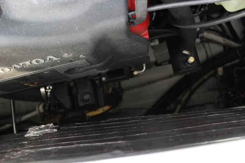  Yacht Photos Pics Engine compartment of a 2002 Regal Commodore 3880 boat, showcasing mechanical components.