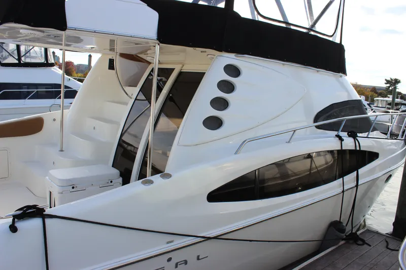  Yacht Photos Pics 2002 Regal Commodore 3880 yacht docked, featuring sleek design and modern amenities.