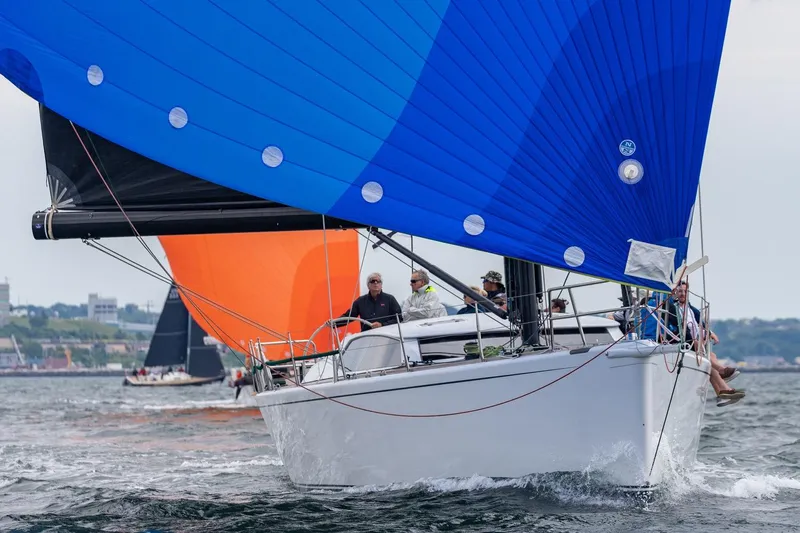 Laura Yacht Photos Pics Sailing yacht Reichel/Pugh 2007 with blue spinnaker on open water.