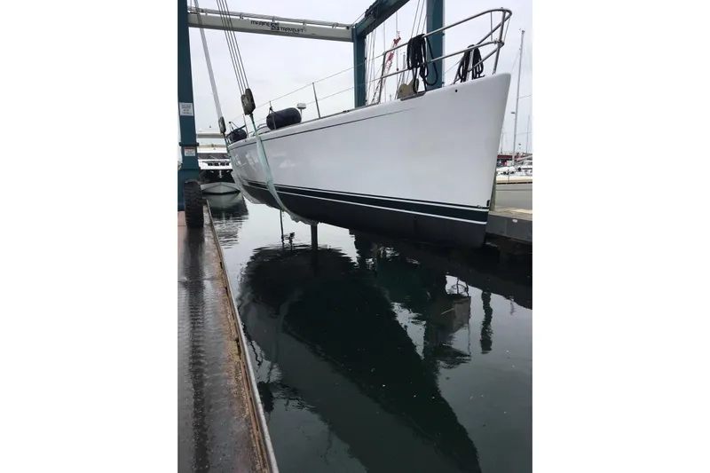 Laura Yacht Photos Pics Sailboat by Reichel/Pugh, 2007 model, suspended over water at a marina.
