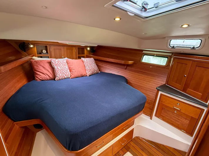 Noble Grace Yacht Photos Pics Luxurious cabin interior of 2019 MJM 43z yacht with wooden finish and cozy bedding.