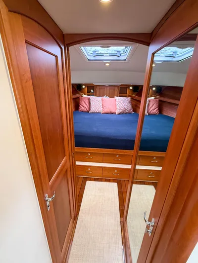 Noble Grace Yacht Photos Pics 2019 MJM 43z yacht cabin with wood finish, skylight, and cozy bedding.