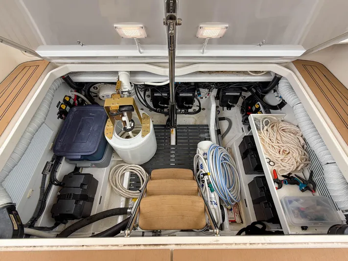 Noble Grace Yacht Photos Pics Engine compartment of a 2019 MJM 43z boat, featuring organized storage and equipment.