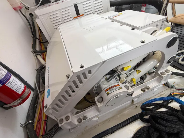 Noble Grace Yacht Photos Pics Engine compartment of a 2019 MJM 43z boat, featuring mechanical components and safety equipment.