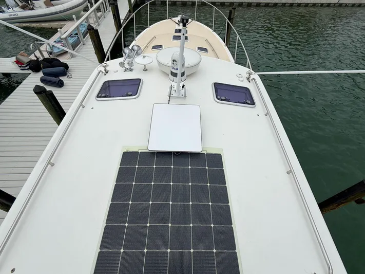 Noble Grace Yacht Photos Pics 2019 MJM 43z yacht with solar panels docked at a marina.