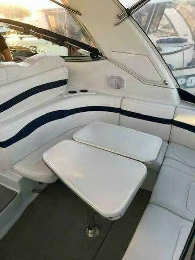 Attitude Is Everything Yacht Photos Pics 2007 Formula 31 PC boat interior with white seating and table.