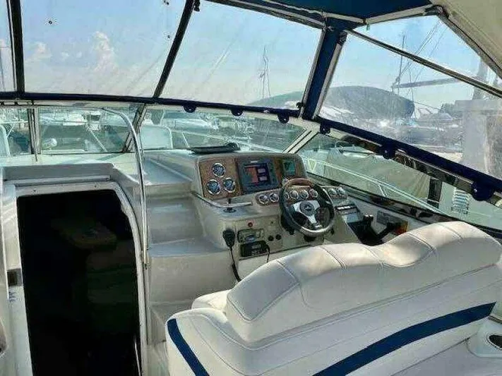 Attitude Is Everything Yacht Photos Pics 2007 Formula 31 PC boat cockpit with steering wheel and control panel.