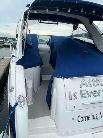 Attitude Is Everything Yacht Photos Pics 2007 Formula 31 PC boat docked, blue cover, "Attitude Is Everything" text, Cornelius, NC.