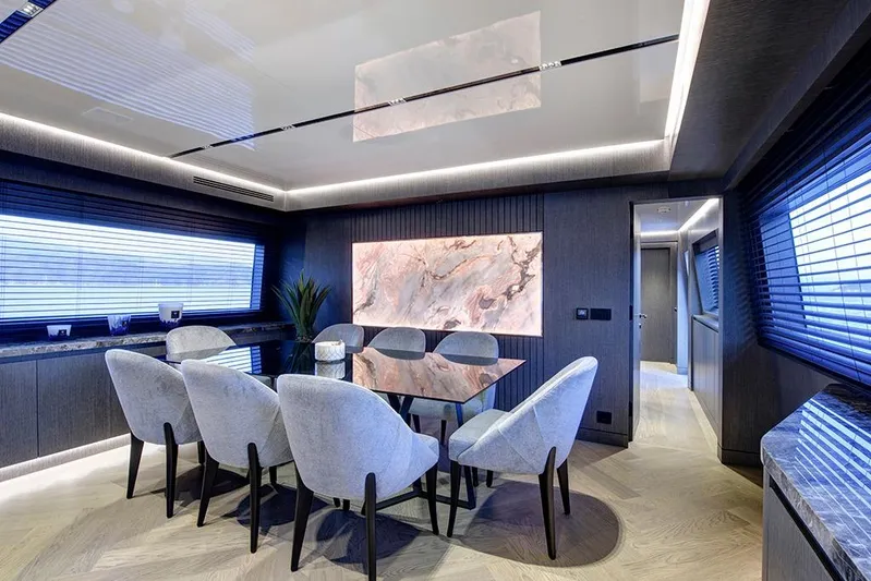  Yacht Photos Pics Luxurious dining area on 1988 Heesen 32 yacht with modern decor and elegant furnishings.