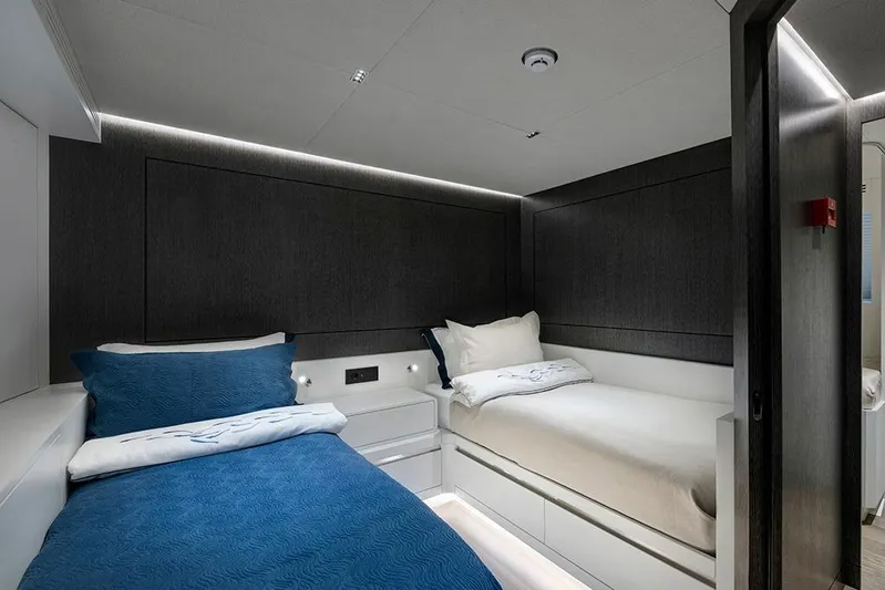  Yacht Photos Pics Luxurious twin cabin interior on 1988 Heesen 32 yacht, featuring modern design and ambient lighting.