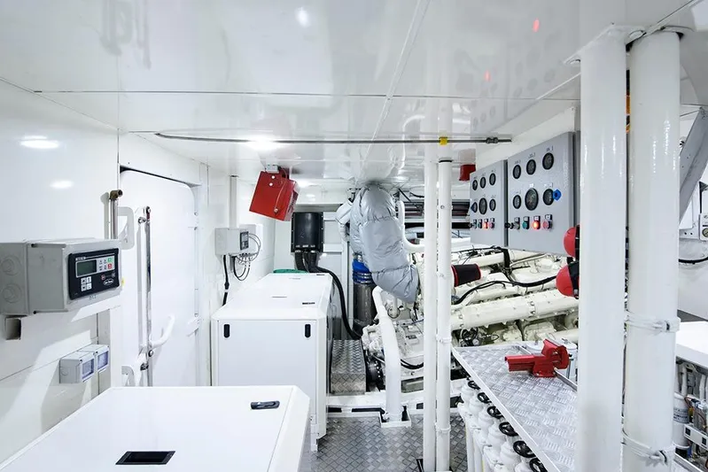  Yacht Photos Pics Engine room of a 1988 Heesen 32 yacht, featuring control panels and machinery.